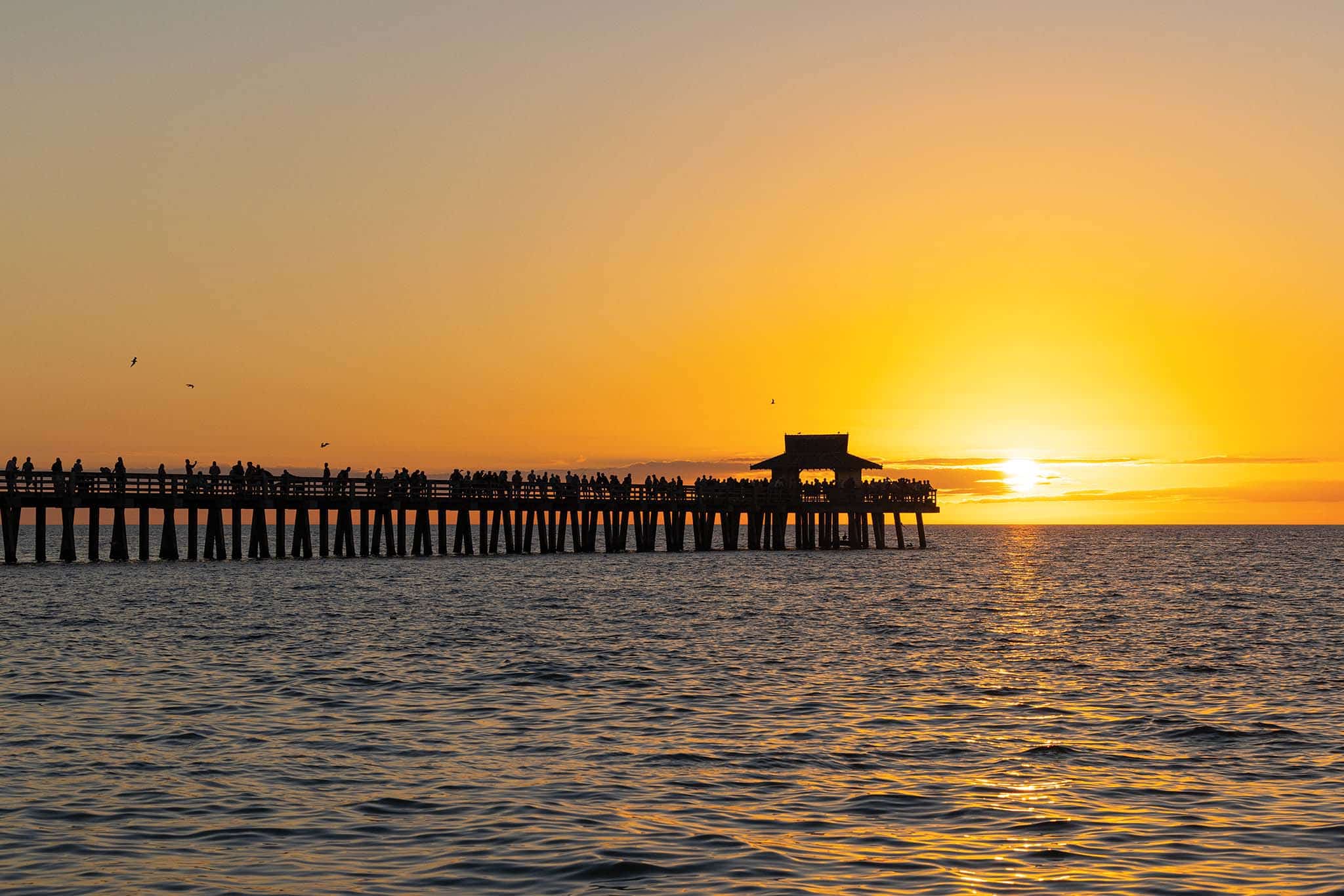 TAKE IN SCENIC SUNSETS FROM THE NAPLES PIER.