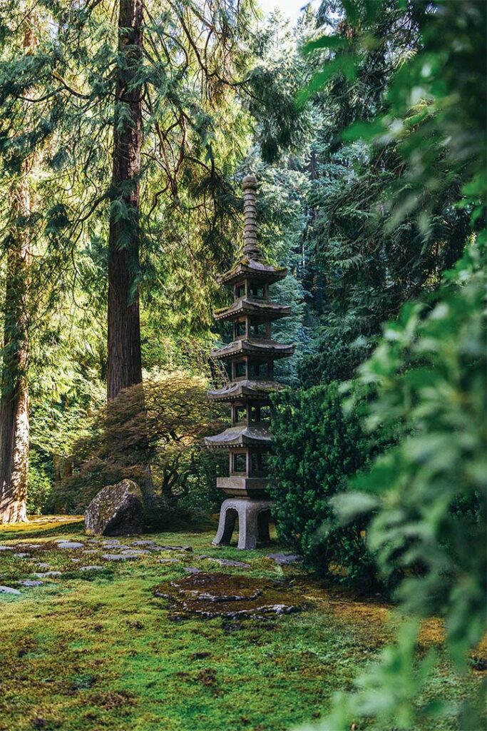 a stone pagoda in a forest