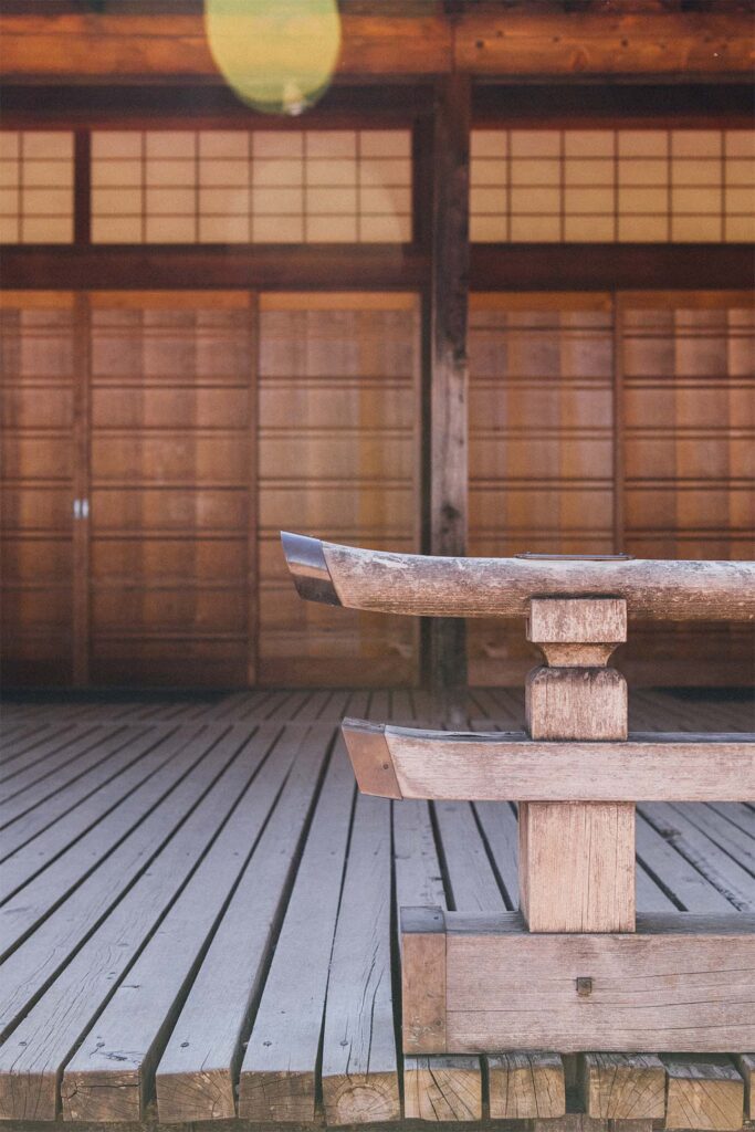 a wooden bench in front of a wooden building