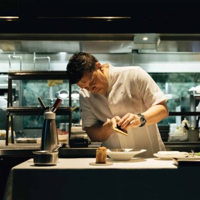 a person in a white shirt preparing food