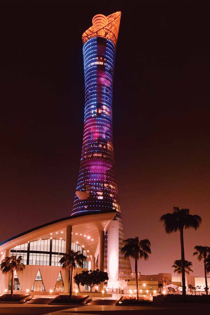 a tall building with colorful lights