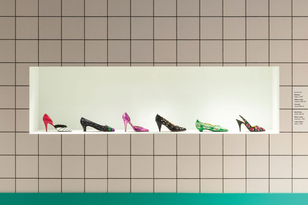 a show exhibit with different types of heels displayed in a window